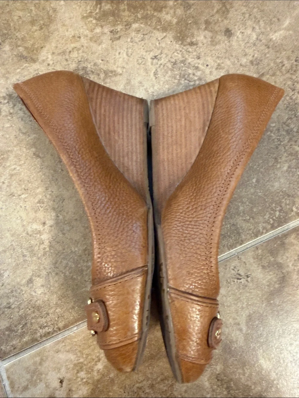 Tory Burch Cognac Leather Logo Cap-Toe Heels- worn on the front